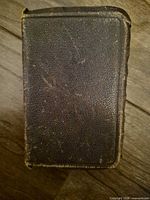 Front cover showing pebbled leather surface and wear