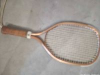 Full view of racquetball racquet showing frame, strings and grip