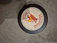 Front of puck showing Belleville Bulls logo and autograph
