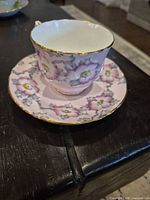Pink floral Staffordshire bone china teacup and saucer with gold trim