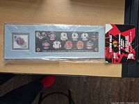Front view of sealed Stan Mikita heritage jersey and stamp display with header card