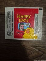 Front view of 1970s Topps Happy Days wax wrapper with logo and graphics visible