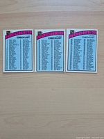 Front view of three vintage hockey checklist cards