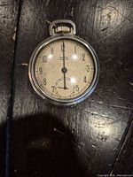 Front view of Westclox pocket watch showing dial layout and condition