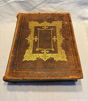 Front cover showing leather binding and gilt decoration