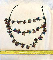 Full view multi-strand necklace with ruler for scale