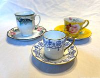 Front view of the three cup and saucer sets