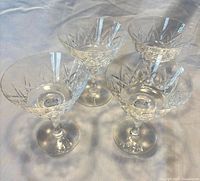 Top angled view of four Elyse pattern crystal glasses