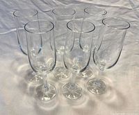 Six clear crystal Bohemia fluted goblets grouped