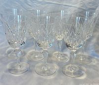 Front view of seven Stuart York lead crystal goblets grouped together