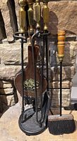 Full view of fireplace tool set on stand with bellows and separate brush