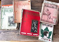 Five visible stacks of vintage French-Canadian magazines showing varied cover designs