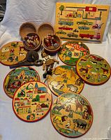 Overall view showing Simplex puzzles, bowling sets with pins/balls, spinning top and jumping jack puppet