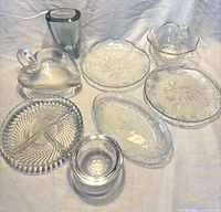 All eight pressed glass items grouped for overview