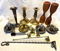 Group view of all candlestick holders, tools, glass holder and brass angels