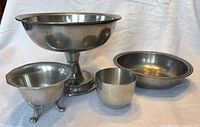 Group shot of all four pewter bowls