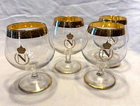 Four Baccarat Napoleon brandy snifters front view