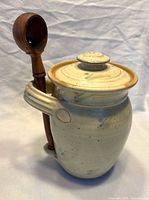 Honey pot with lid and dipper attached