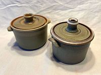 Two Frankoma stoneware casseroles with lids in place