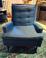 Front view of high-back blue Kroehler armchair showing upholstery, tufting, seat and arms