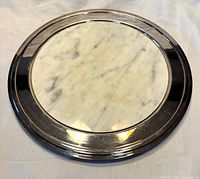 Top view of assembled tray showing stainless rim and marble center