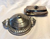 Both butter dishes closed, showing shapes and lids