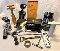 Group shot showing all bar tools and 1940s cocktail recipe booklet