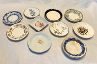 All ten butter pats front view showing patterns and shapes