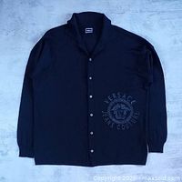 Full view of black Versace wool button-up sweater showing overall design and condition