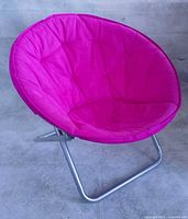 Front view of pink saucer chair showing seat and frame