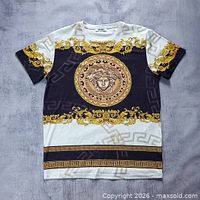 Front view of Versace baroque graphic T-shirt laid flat
