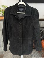 Full front view of black suede Bernardo jacket