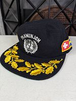 Front view showing PANMUNJOM text, UN wreath and gold oak leaf embroidery