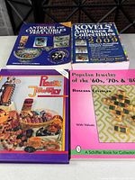 All four books laid out showing front covers