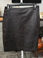 Front view of dark brown leather pencil skirt