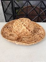 Full view of woven straw sun hat