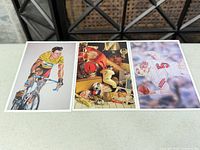 Fronts of all three postcards laid side by side