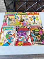 All six comics laid out showing full covers