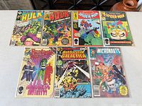 Top view showing all eight bagged comics