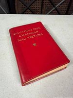 Front cover of red leatherette book with gilt title and star