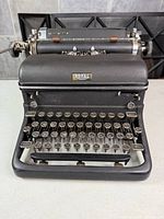 Front view showing keyboard, logo and housing