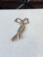 Front view of sterling silver bow brooch