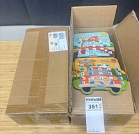 Open carton showing stack of Road Trip Bingo boards