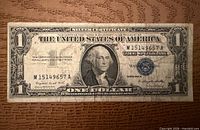 Full front view of 1957 $1 silver certificate showing blue seal and serial M15149657A
