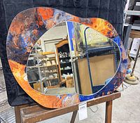 Front view of mirror showing full shape and colours