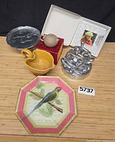 Group overview showing all items: horse dish, napkin holder, picture frame, pitcher, bird plate, teapot on box