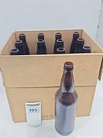 Cardboard case holding 12 brown brewing bottles