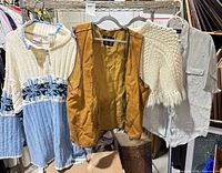 Group shot of all four clothing items hanging