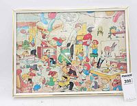 Front view of framed completed Family Circus cartoon puzzle
