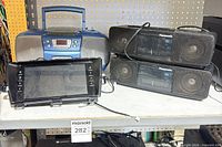 Group shot of all four electronic items on shelf